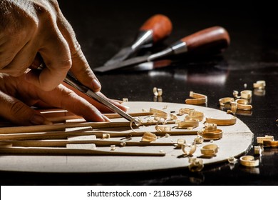 Luthier Making Top Of Guitar