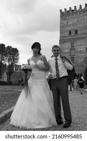 Lutsk, Ukraine - August 30 2009: Young Bride And Groom Posing In Old Castle