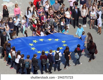 Lutsk, Ukraine - May 17, 2014: Young People Holding A Big Flag Of European Union During Europe Day 