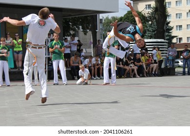Lutsk, Volyn province, Ukraine - 30 June 2013: street performance of Capoeira group members including kids, in a group, duo and solo