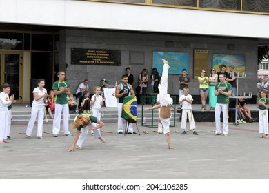 Lutsk, Volyn province, Ukraine - 30 June 2013: street performance of Capoeira group members including kids, in a group, duo and solo