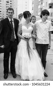 Lutsk, Volyn / Ukraine - August 30 2009: The bride and guests leave the house
