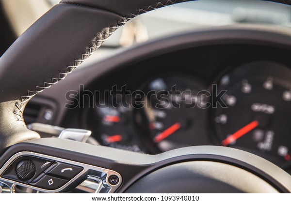 luxe car steering wheel\
and dashboard