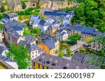 Luxembourg City historical centre aerial view with old colorful buildings on narrow streets, Pont du Grund bridge across Alzette river, top view of Luxembourg old town Grund district