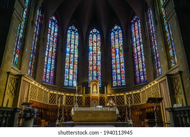 Luxembourg City, Luxembourg - September 24 2019: The stained glass windows and chancel featuring the choir and altar of Notre Dame Cathedral