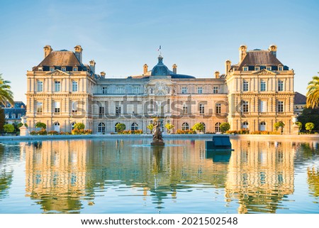Luxembourg garden with pond, fountaine and building of Luxembourg Palace with no people. Paris, France