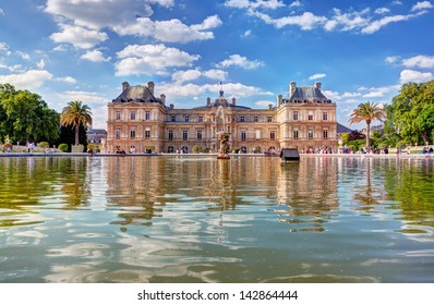 The Luxembourg Palace in The Jardin du Luxembourg or Luxembourg Gardens in Paris, France. View on the main facade and water pond