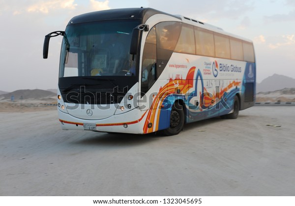 Luxor Egypt - FEBRUARY 07, 2019: Colorful white and\
red excursion bus