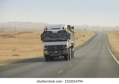 LUXOR, EGYPT - MAY 04, 2018: Local Road  Traffic In Luxor. Trucking In Africa. Mercedes-Benz Freight Truck With Cargo On The Road. Industrial Heavy Load Commercial Truck. Space For Text.