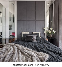 Luxurious Bedroom With King Size Bed, Upholstered Wall And Mirror