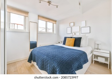 Luxurious Bedroom With Soft Bed And Blue Bedspread