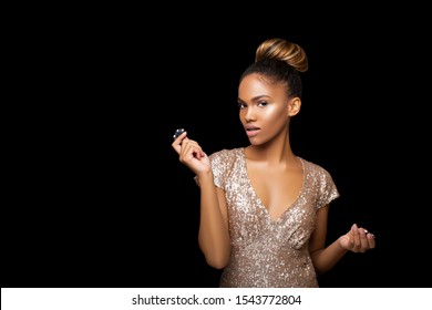 Luxurious Black Afro American Girl With A Perfect Hairstyle And Bright Make-up Is Posing With Casino Chips In Her Hands. Casino, Poker And Roulette. Gambling Dark-skinned Woman Lucky With Perfect Card