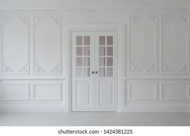 Luxurious Bright Interior Of The Living Room In Baroque Style With Stucco And Double Door.