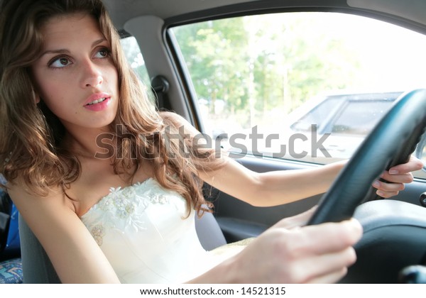 luxurious\
brunette in white cloth emotional controls\
car