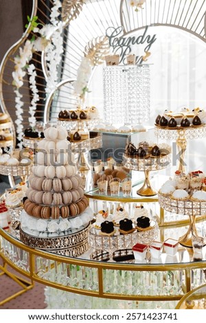 Luxurious candy bar buffet displaying a variety of delicious pastries, macarons, and sweets, creating an elegant and tempting dessert display
