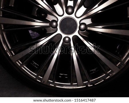 Luxurious chrome alloy car wheels taken close up.
