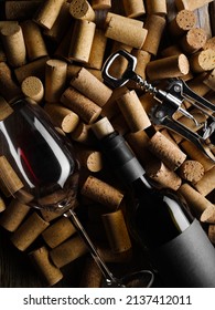 Luxurious Composition - A Bottle Of Red Wine, Corks And A Corkscrew. Close-up. There Are No People In The Photo. Restaurant, Hotel, Date, Romantic Evening, Holiday. Advertising, Banner.