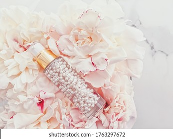 Luxurious Cosmetic Bottle As Antiaging Skincare Product On Background Of Flowers, Blank Label Packaging For Body Care Branding Design