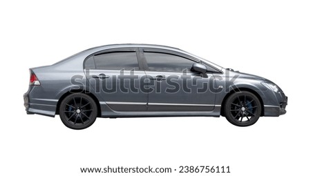 Luxurious dark gray sedan sports car is isolated on white background with clipping path.