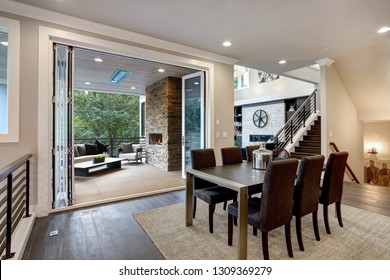 Luxurious Dining Room With View Of Outdoor Living Area.