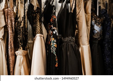 Luxurious evening night out sparkling dresses hanging on the rack. High fashion concept, haute couture, designer 