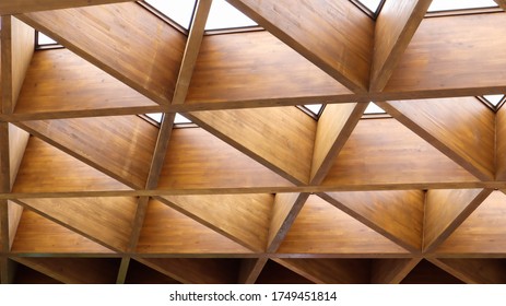 Luxurious Geometric Wooden Triangles In Construction. The Concept Of Modern Architecture, Design And Interior. Wood Background. Modular Canopy Or Roof.