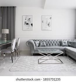 Luxurious and glamour style living room interior with quilted corner sofa, glass coffee and dining tables and fancy chairs