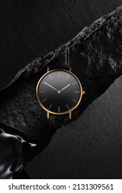 Luxurious gold watch with a black dial. A watch on a beautiful black background with black stones. Women's, Men's fashion - Shutterstock ID 2131309561