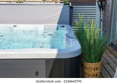 Luxurious hot tub on the backyard terrace.