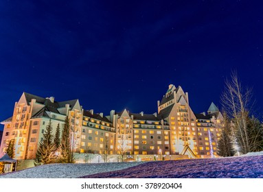 A luxurious hotel at night at the base of Whistler Mountain, Canada