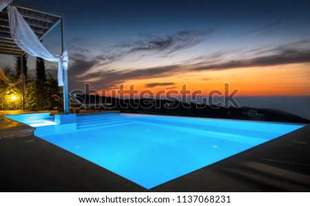 Luxurious Infinity Pool At Sunset