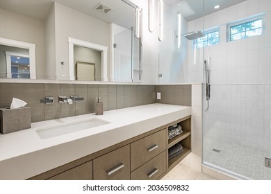 Luxurious Interior Bathroom With Barn Door White Tile Glass Shower And Makeup Counter