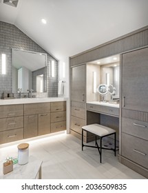 Luxurious Interior Bathroom With Barn Door White Tile Glass Shower And Makeup Counter