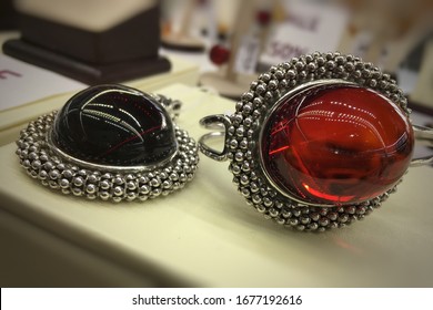 Luxurious Jewelry With Red Mexican Amber In Silver Frames. Photo For Decoration Jewelry Store.