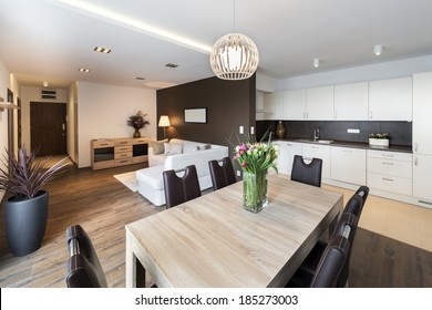 Luxurious Kitchen With Living Area In Background 