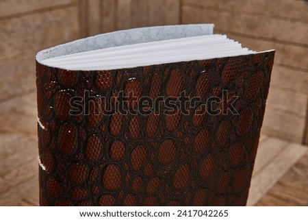Luxurious Leather-bound Journal with Reptilian Texture on Wood
