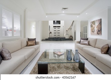 Luxurious Living Room With Grand Entrance In The Background