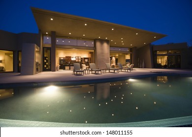 Luxurious And Modern House With Swimming Pool At Night