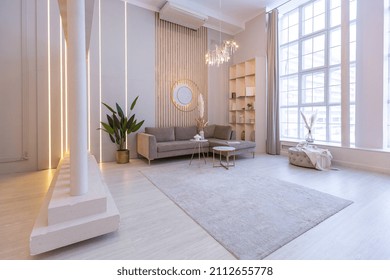 luxurious modern interior of the living room of an expensive spacious bright apartment. upholstered furniture and decorative lighting, soft pastel colors and cozy atmosphere - Powered by Shutterstock