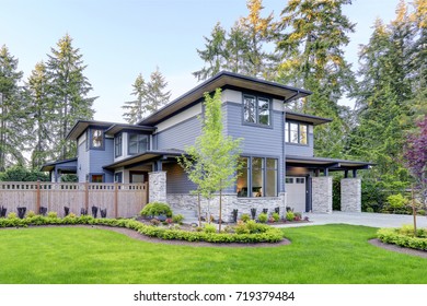 Luxurious New Home With Curb Appeal. Trendy Grey Two-story Mixed Siding Exterior In Bellevue With A Hip Roof And Large Picture Windows. Northwest, USA