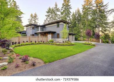 Luxurious New Home With Curb Appeal. Trendy Grey Two-story Mixed Siding Exterior In Bellevue With Well Manicured Front Yard And Asphalt Driveway. Northwest, USA