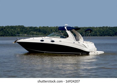 Luxurious Pleasure Boat Slowly Cruising Down A River.