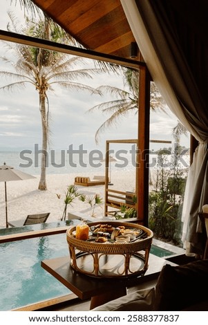 Luxurious poolside breakfast setup at a beachfront villa in Koh Lipe, Thailand. Featuring a private pool, tropical surroundings, and elegant dining, perfect for a serene and indulgent getaway