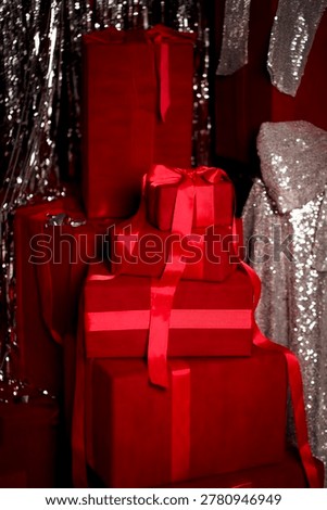 Luxurious red gift boxes wrapped with satin ribbons, ideal for premium branding, romantic occasions, and elegant marketing visuals.