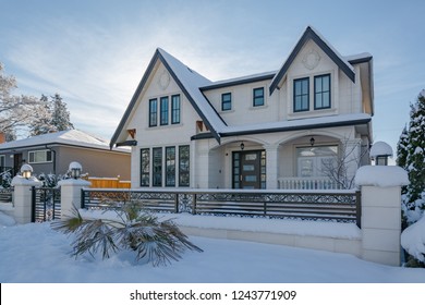 Luxurious Residential House With Front Yard In Snow. North American Family House On Winter Sunny Day