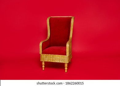 Luxurious Santa Claus Throne Standing Over Red Studio Background.