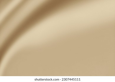 A luxurious smooth and elegant beige satin background with earthy or gold-colored fabric