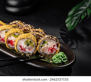 Luxurious sushi roll adorned with sesame seeds, served with wasabi, ginger, and soy sauce on a dark background - Powered by Shutterstock