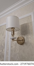 Luxurious wallmounted lights create inviting hotel corridor ambiance