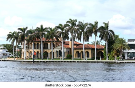 Luxurious Waterfront Home In Fort Lauderdale Surrounded By Tall Royal Palm Trees. 